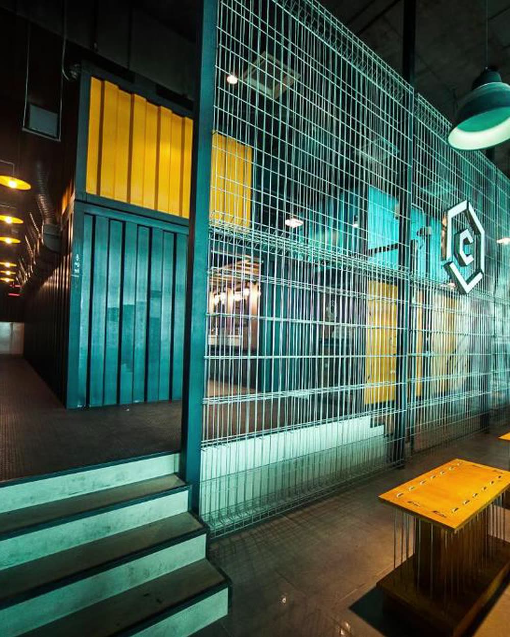 An industrial lounge with mesh screening and a Capsule sign on the wall &mdash; Capsule Transit, KLIA2, Sepang, Malaysia